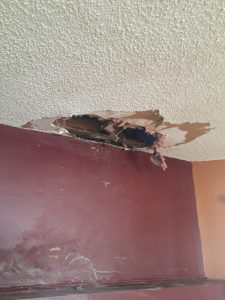 Denied roof damage claim by insurance company